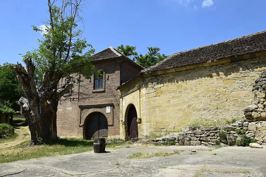 A brick and stone wine cellar with a wooden barrel in the Negotinska Krajina wine region near Negotin