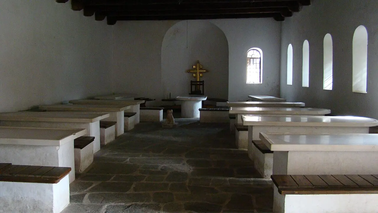 The white marble churches and arcaded lodging inside the walls of Studenica monastery