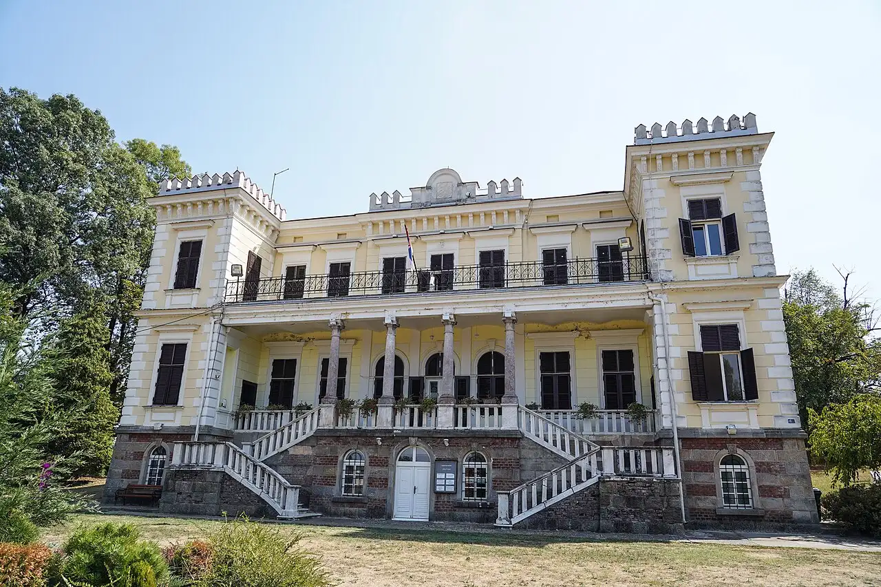The yellow neoclassical Belimarkovic Castle in the spa park at Vrnjacka Banja