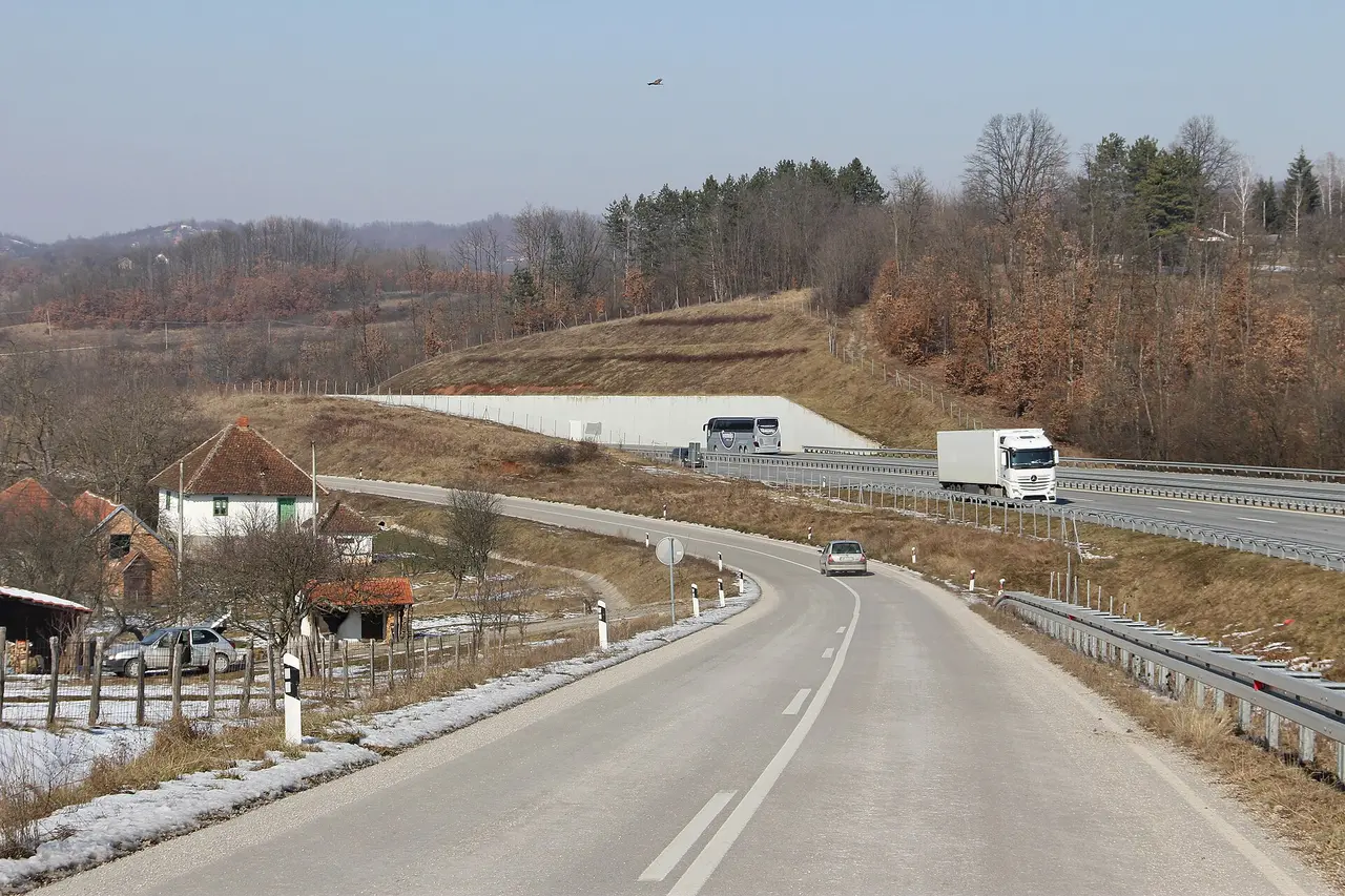 The A2 Milos Veliki motorway running alongside the old two-lane road through winter countryside