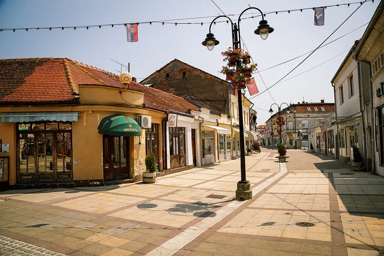 The pedestrianised shopping street in central Valjevo lined with cafes and flower baskets