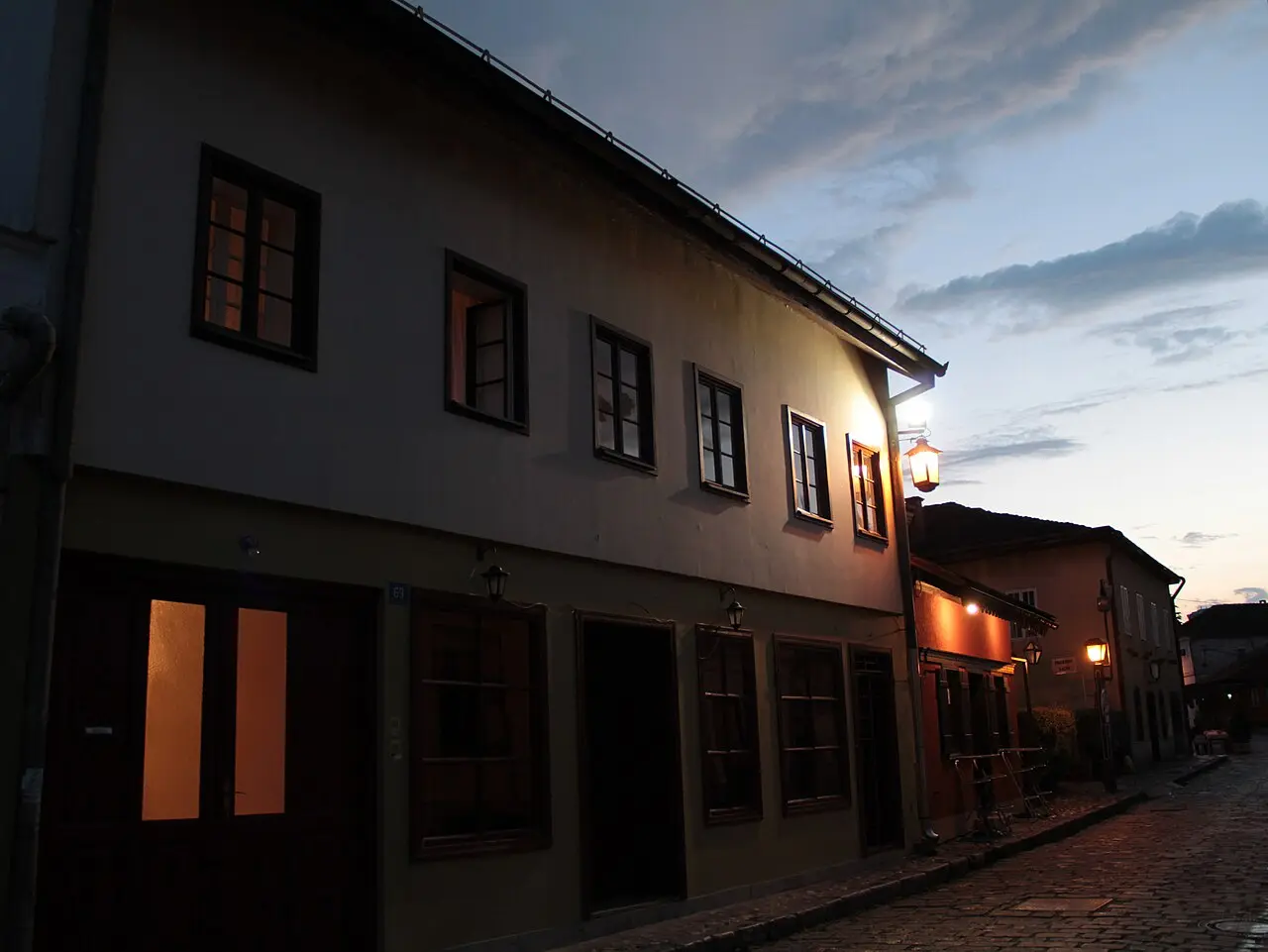 The Tesnjar old quarter of Valjevo lit up at dusk with warm light in the windows