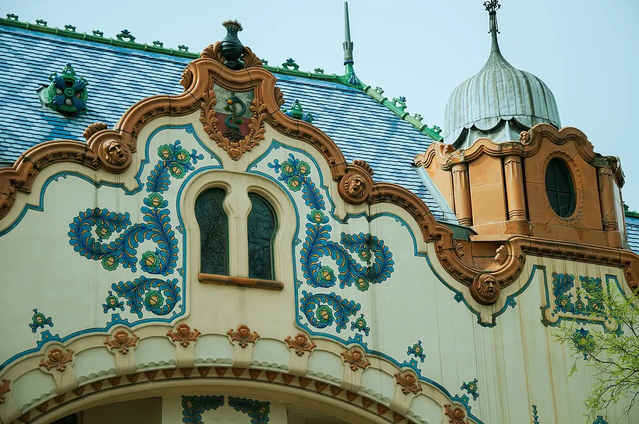 The blue floral ceramic facade and turret of the Raichle Palace in Subotica