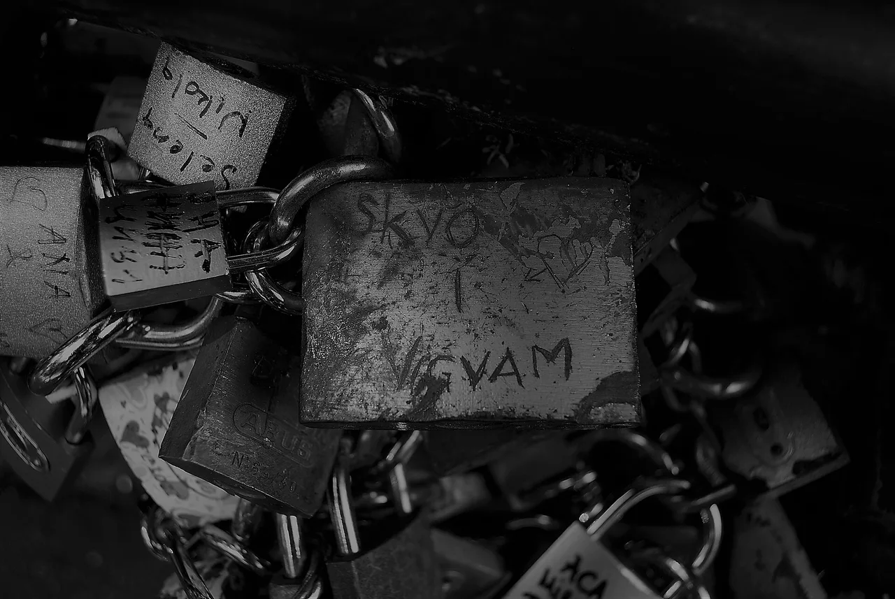 Padlocks engraved with names attached to the railing of the Bridge of Love in Vrnjacka Banja