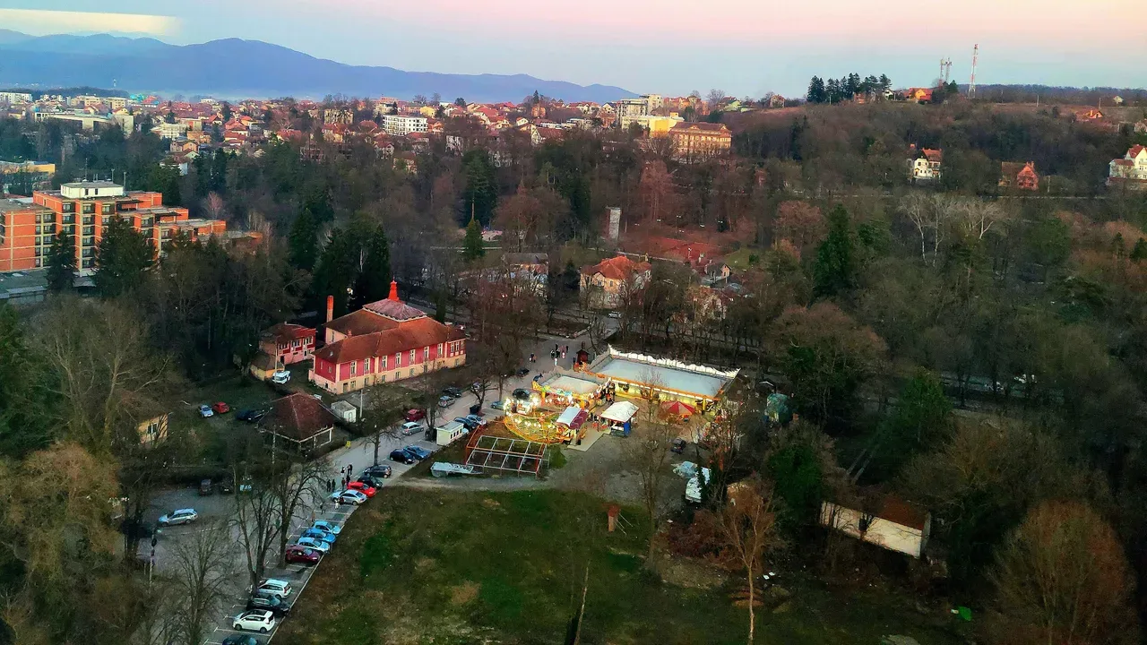Aerial view over Vrnjacka Banja from the panoramic wheel, with the green spa park and rooftops below the hills