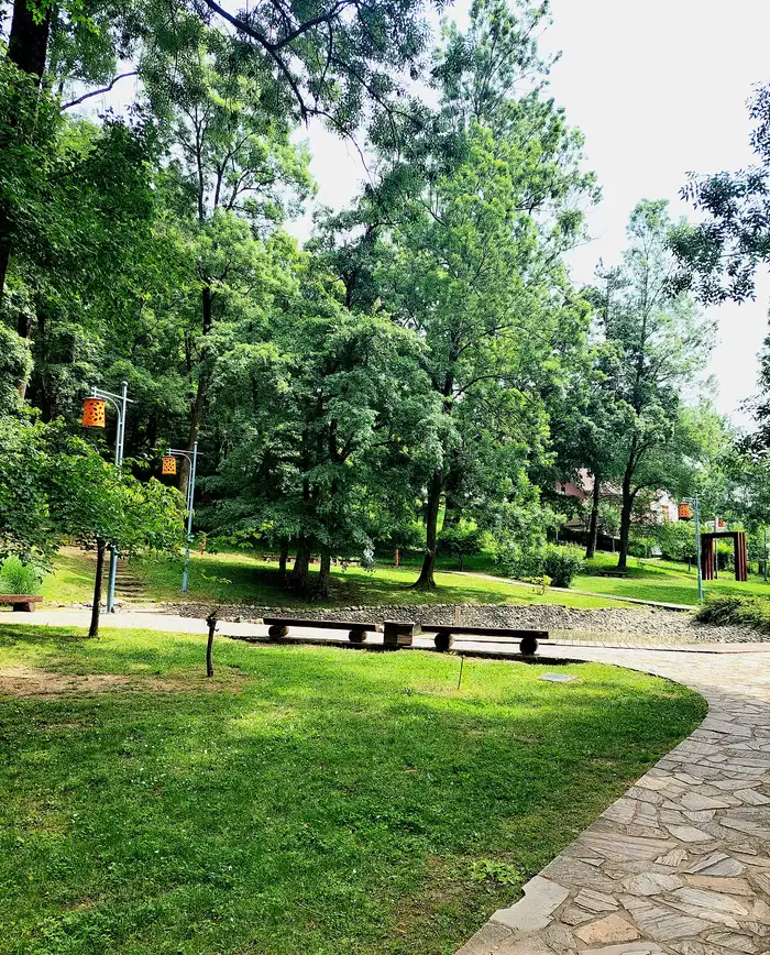 The Japanese garden corner of the park in Vrnjacka Banja with clipped shrubs and a small pond