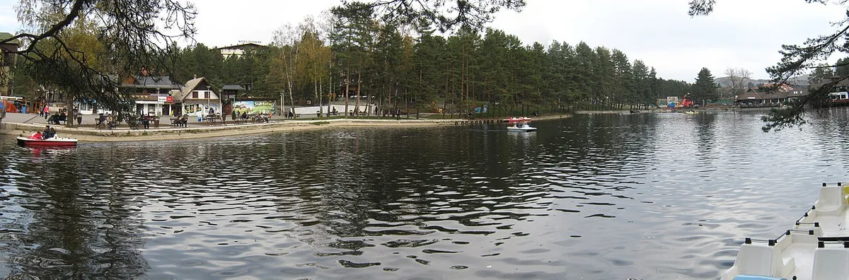 The central lake of Zlatibor resort with the lakeside promenade, restaurants and pedal boats