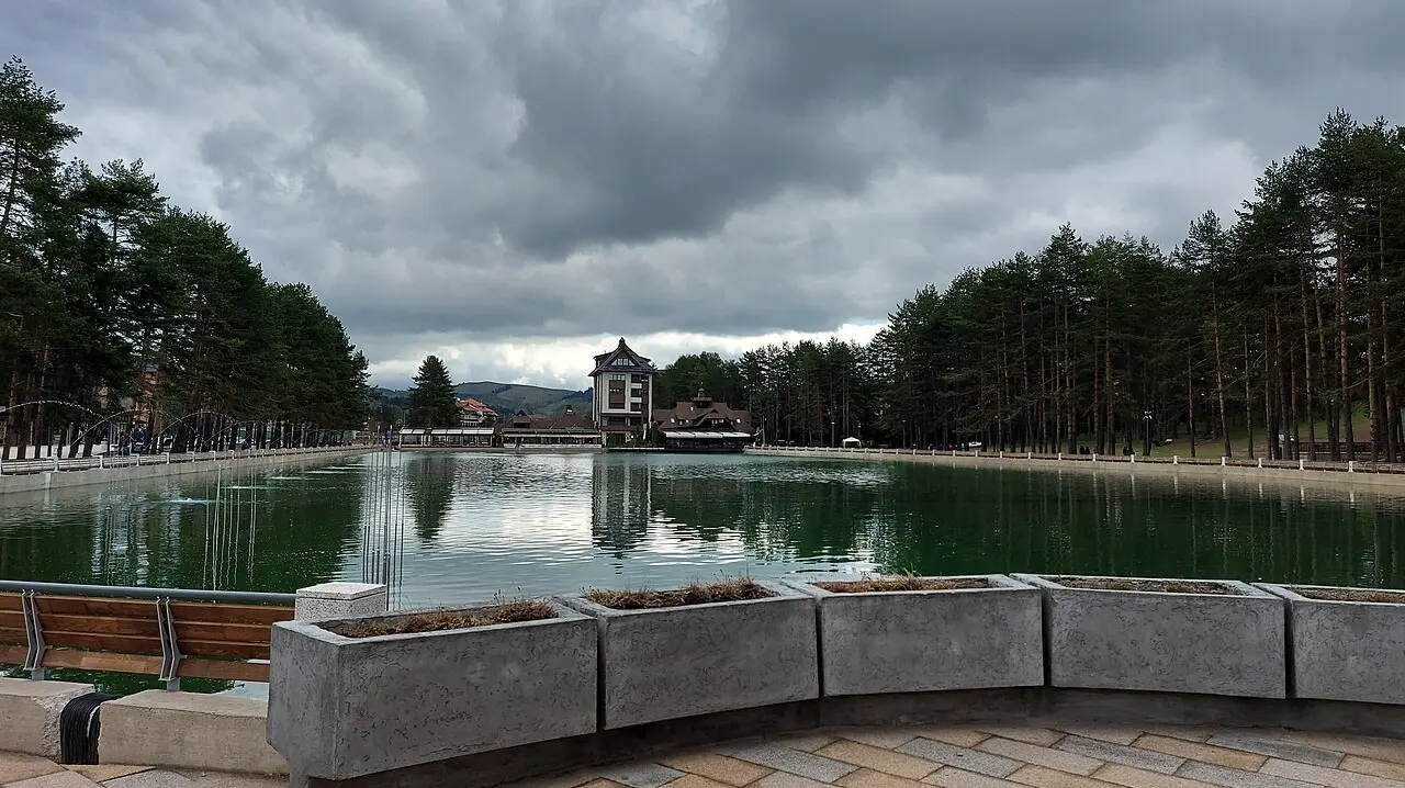 The centre of Zlatibor resort with its lake, promenade and low mountain skyline in western Serbia